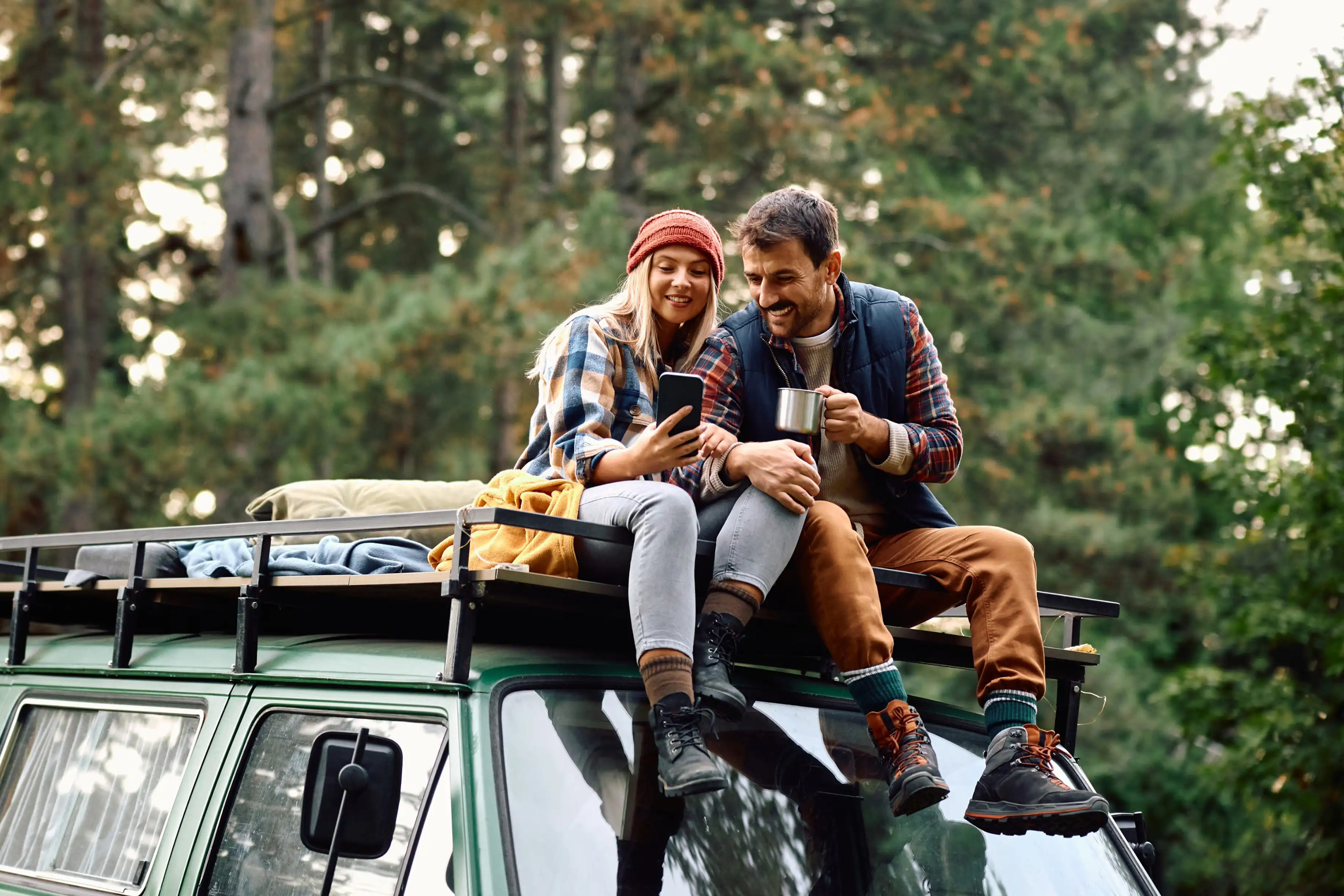 Couple and campervan in the mountains